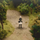 A character stands on a path through a forest in what looks like a miniature diorama.